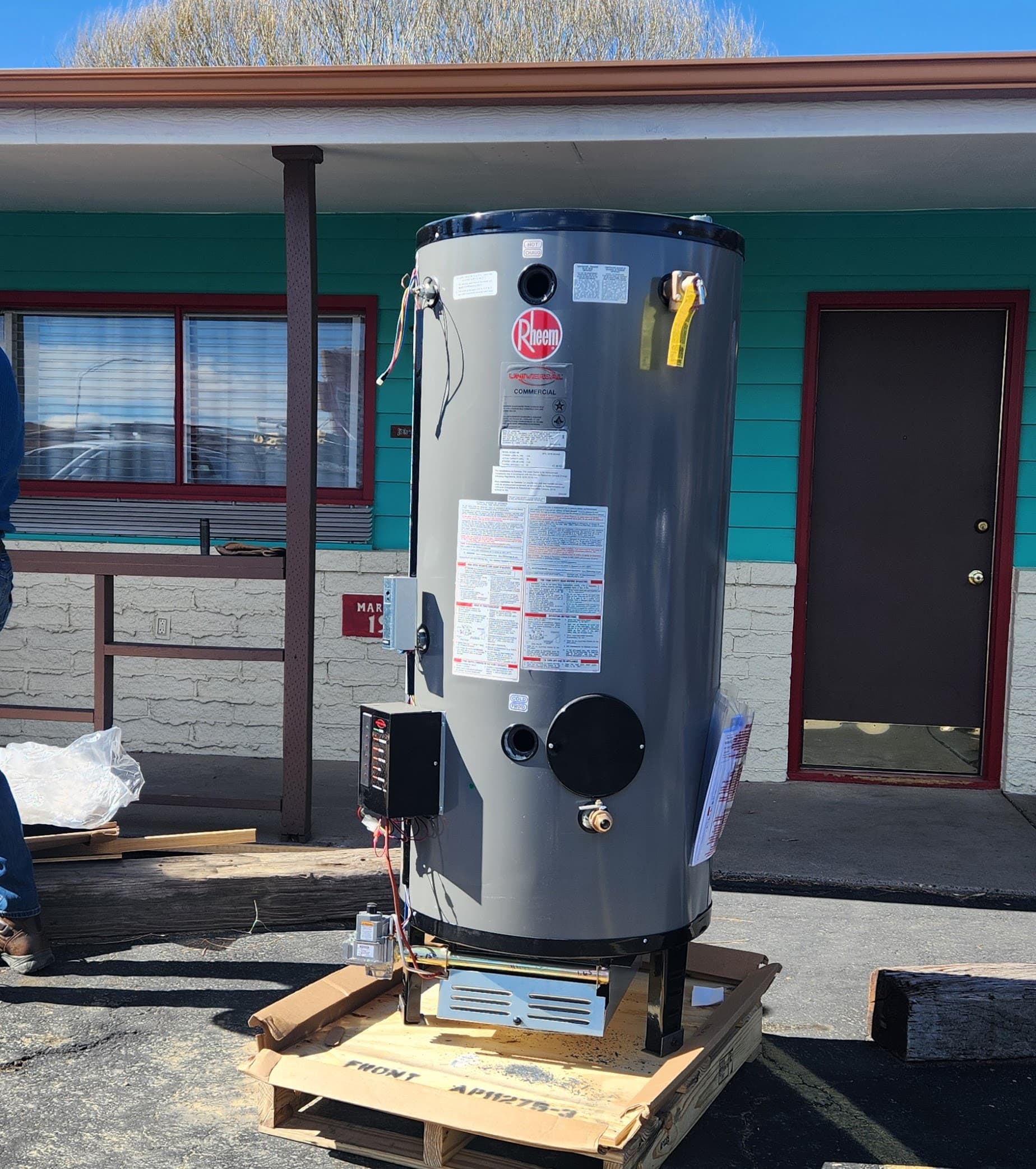 new commercial water heater sits in outside motel new commercial water heater sits in outside motel